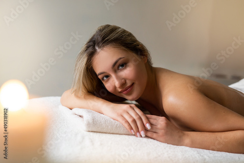 portrait of a cute beautiful woman lying on a massage 