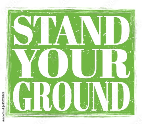 STAND YOUR GROUND, text on green stamp sign