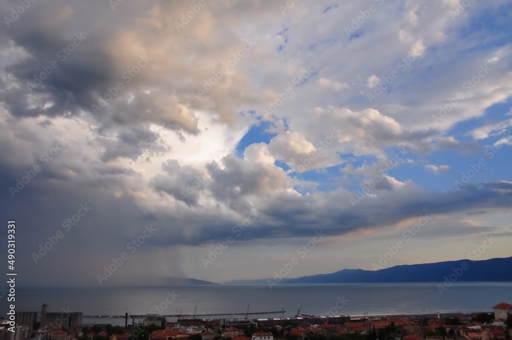 Stormy black clouds in Croatian coastline.Dark sky and black clouds at dusk. Dark sky and rain clouds. Dark storm and rainy at night. Dramatic cloudscape in rain weather. Stormy clouds