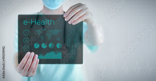 e-Health (Electronic Health). Doctor holding virtual letter with text and an interface. Medicine in the future