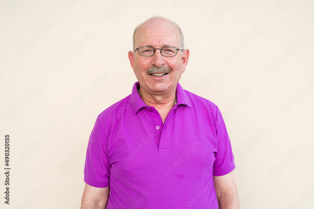Portrait of happy senior man looking at camera Portrait of happy senior man looking at camera