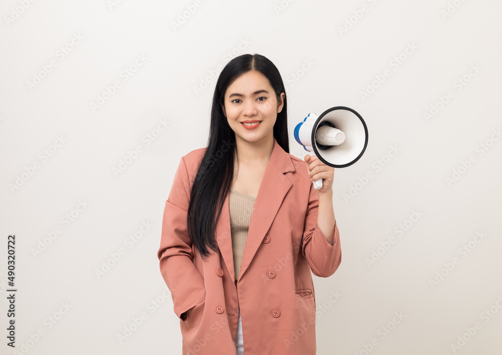 Shout out loud with megaphone. Young beautiful asian woman announces with a voice about promotions and advertisements for products at a discounted price. Standing on isolated white background. Shout out loud with megaphone. Young beautiful asian woman announces with a voice about promotions and advertisements for products at a discounted price. Standing on isolated white background.