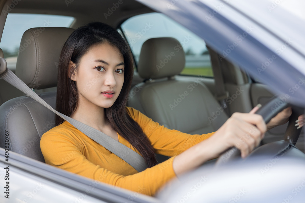 Young beautiful asian women getting new car. she very happy and excited. she sit and touching every detail of car. Smiling female driving vehicle on the road Young beautiful asian women getting new car. she very happy and excited. she sit and touching every detail of car. Smiling female driving vehicle on the road