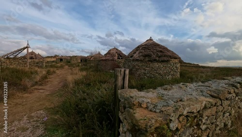 Timelapse on a cloudy day of ancient Celtic dwellings at the Castromao fort in Celanova, Galicia Spain. photo