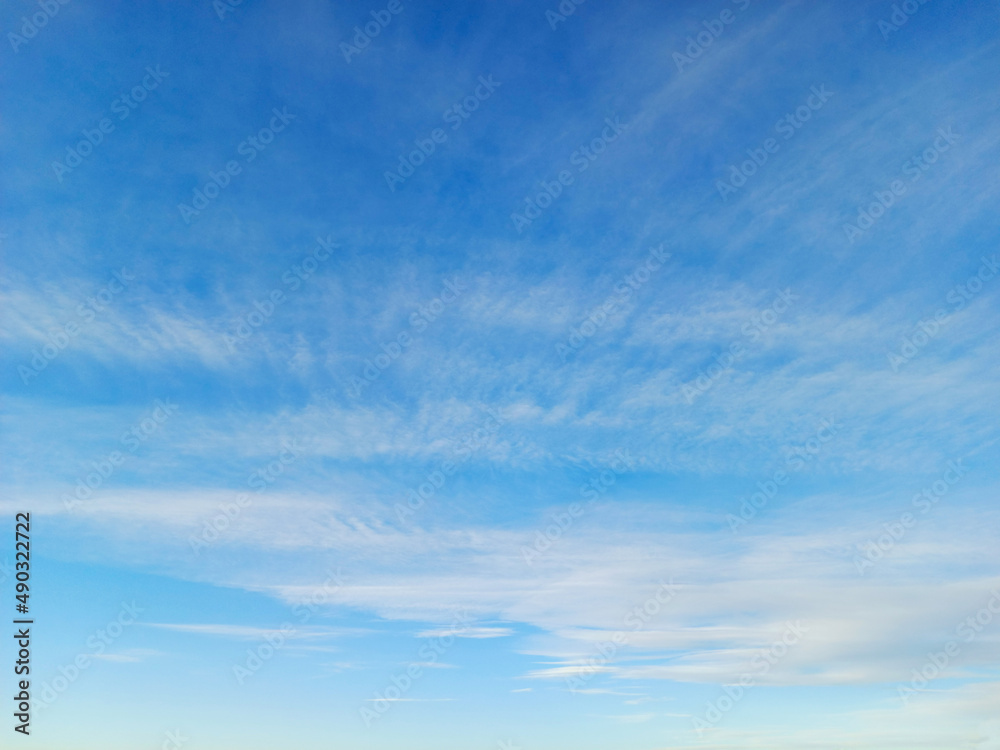 Cirrus and altostratus clouds in the blue sky. Colorful sky background Cirrus and altostratus clouds in the blue sky. Colorful sky background