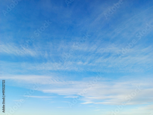 Cirrus and altostratus clouds in the blue sky. Colorful sky background photo