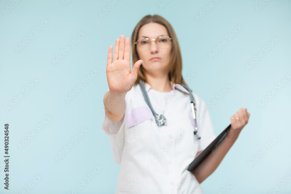 Foto de Beautiful woman doctor with a stethoscope and a black tablet ...