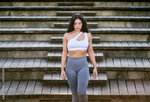 a sportswoman walking down the stairs