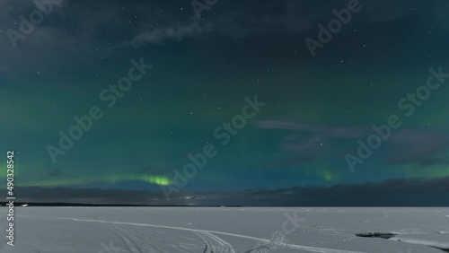 Amazing timelapse of beautiful northern lights at Lake Ladoga. Aurora borealis 4K footage.