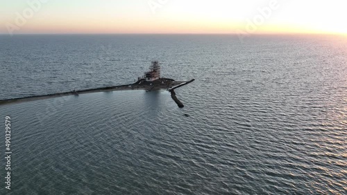 Aerial view of the Paard van Marken at sunrise traditional historic monument lighthouse on the island of Marken in The Netherlands. Small fishing village in Europe. photo