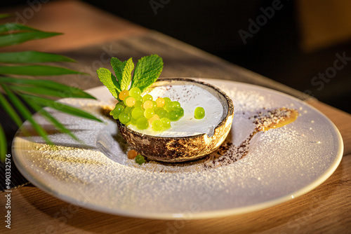 Coconut Ice Cream with mint and citrus caviar