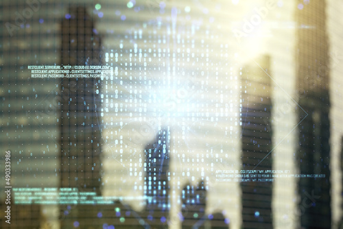 Double exposure of abstract virtual creative code skull hologram on modern skyscrapers background. Malware and cyber crime concept