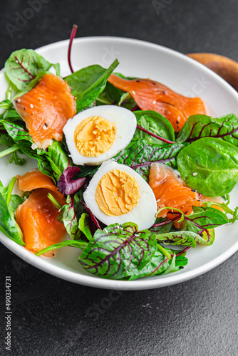 salad salmon, egg, green leaves lettuce fresh portion healthy meal food diet snack on the table copy space food background 