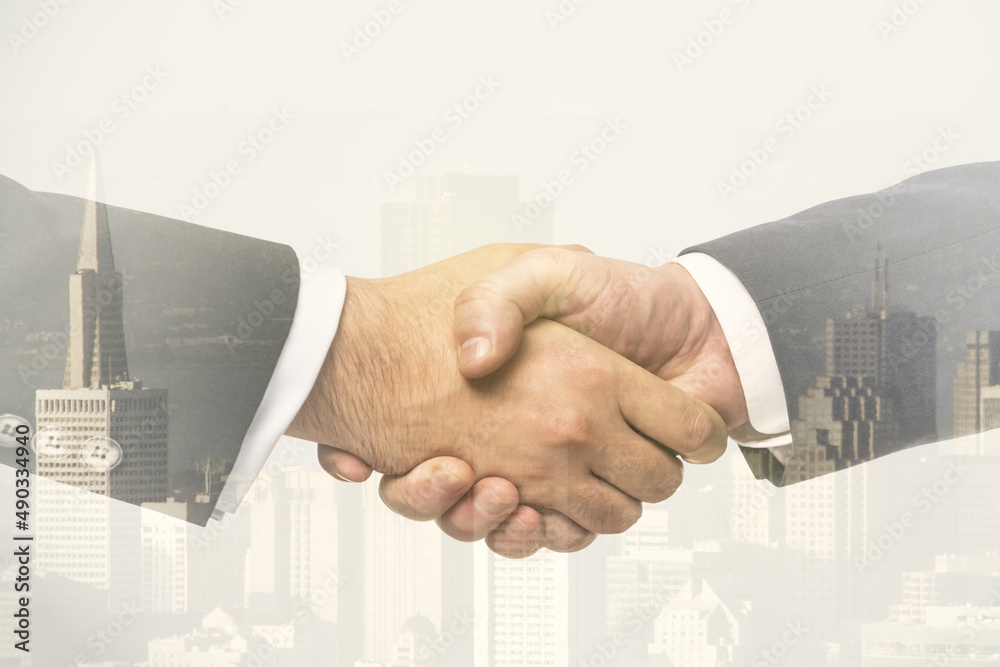 Multi Handshake Multi exposure of handshake two businessmen on city skyline background ...