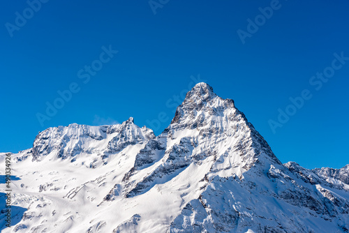 High snowy mountain peak in Dombai in Russia