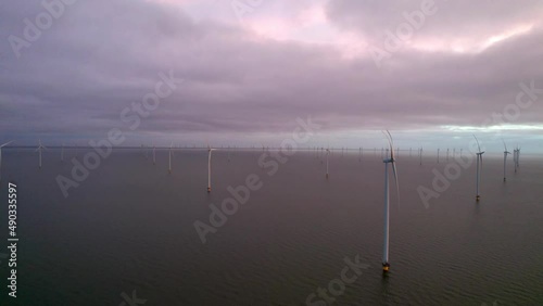 Windturbine 1 Nederland IJsselmeer met zware bewolking photo
