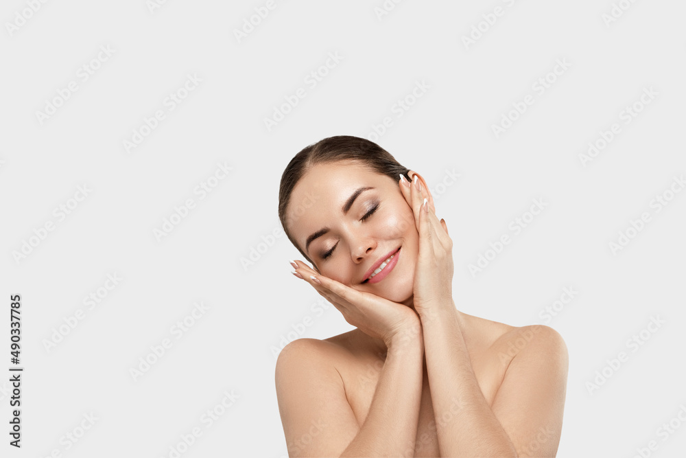 Beautiful Young Woman with Clean Fresh Skin touch own face. Facial treatment. Cosmetology, beauty and spa. Skin care. Model With Natural Makeup Beautiful Young Woman with Clean Fresh Skin touch own face. Facial treatment. Cosmetology, beauty and spa. Skin care. Model With Natural Makeup