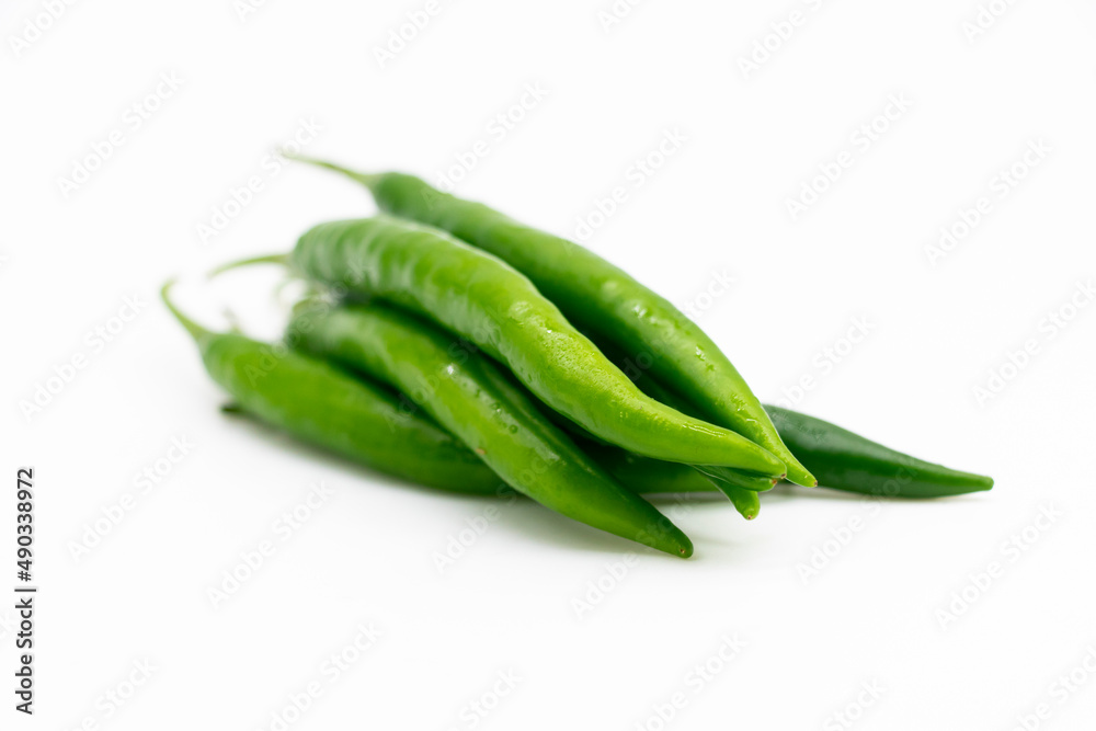 Fresh green chilies close up on white background Fresh green chilies close up on white background