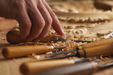 Craftsman carving with a gouge. Woodworker hand closeup. Workbench with equipment. Wood carving tools. Chisels for carving