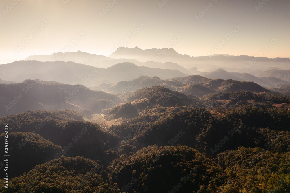 Scenery of Doi Luang Chiang Dao with stacked mountain layer and foggy on sunny day