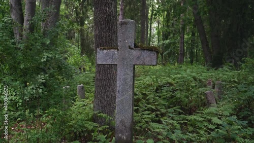 tombstone of an abbandoned graveyard in the woods