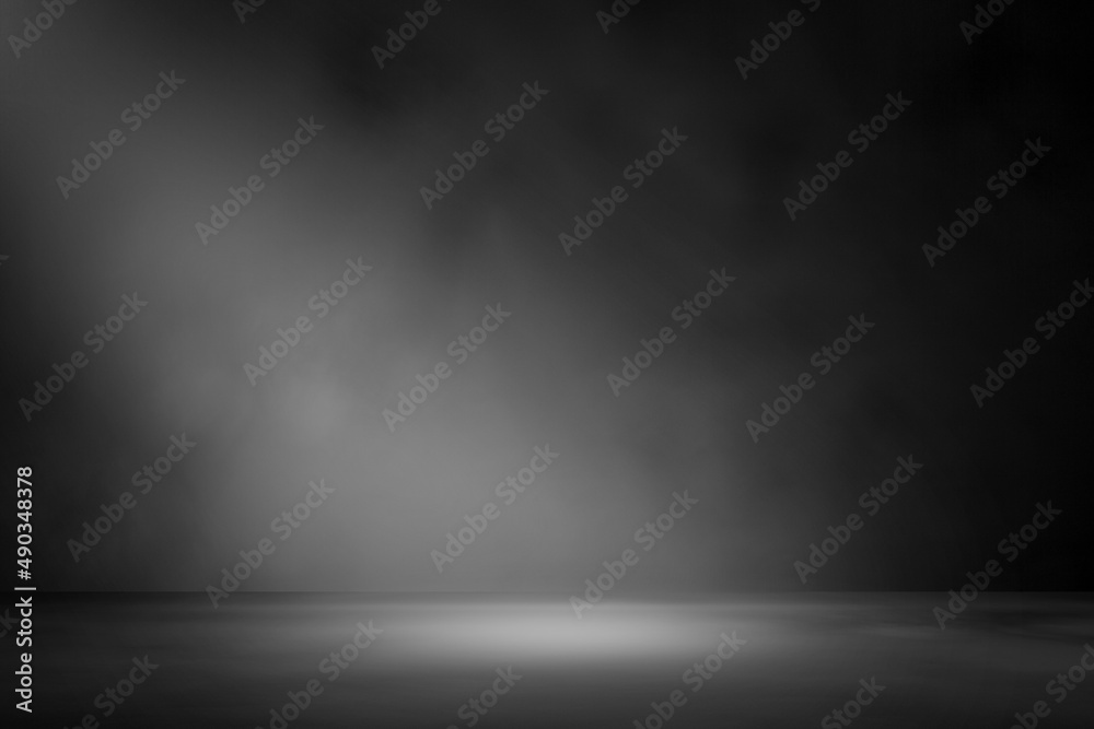 Dark abstract walls are empty and gradient studio rooms with smoke floating within surfaces and bright lights. for displaying products on the background wall Dark abstract walls are empty and gradient studio rooms with smoke floating within surfaces and bright lights. for displaying products on the background wall