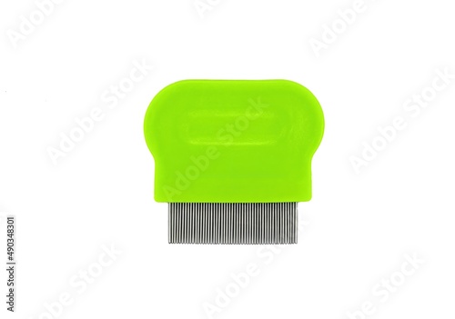 green lice comb isolated on a white background photo