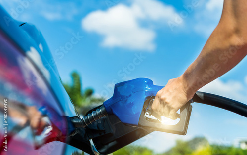 Картината върху платно Woman hand refuelling the car
