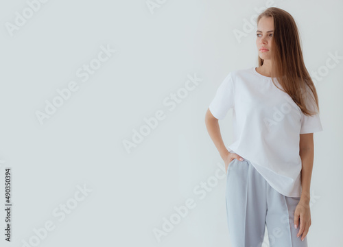 Ukrainian  young  woman in sweatshirt mock up on light background. Female body and style concept. Advertisement or clothes sale design. Mock up for design, clothes shop sale. © Forewer