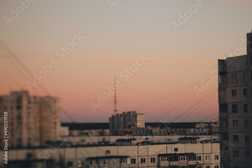 Art landscape with a view of the city and sunset. With film, grain and blur effects