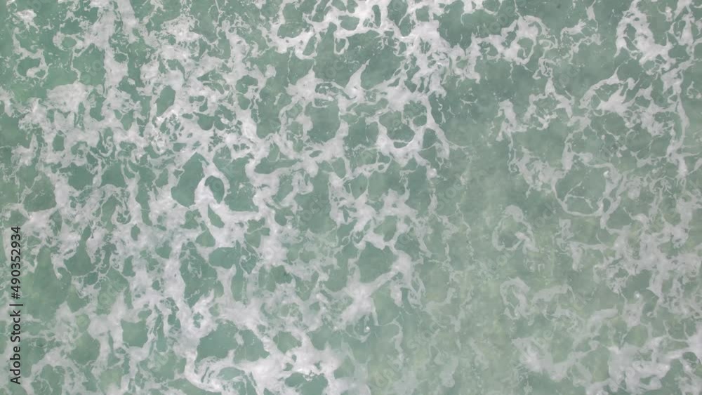 Bubbles made by several waves on the beautiful crystal ocean near the beach. Bubbles made by several waves on the beautiful crystal ocean near the beach.