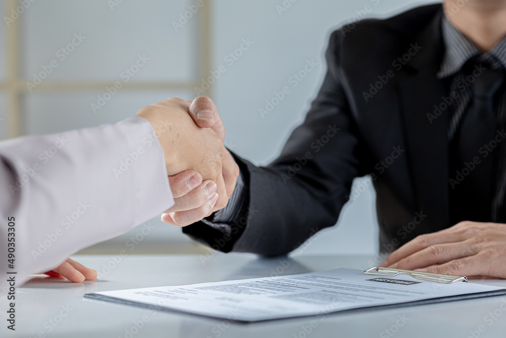 Managers and job applicants shake hands after the job interview, job interviews to find people to work with the company and talent to work with. Concept of recruitment and job interviews. Managers and job applicants shake hands after the job interview, job interviews to find people to work with the company and talent to work with. Concept of recruitment and job interviews.