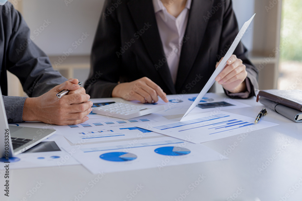 The sales department is having a monthly summary meeting to bring it to the department manager, they are verifying the correctness of the documents that are prepared before bringing in to the manager The sales department is having a monthly summary meeting to bring it to the department manager, they are verifying the correctness of the documents that are prepared before bringing in to the manager
