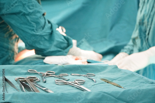 The surgical device is placed on a sterile green cloth in the operating room.