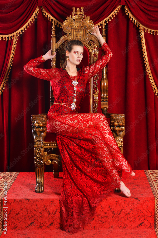 Portrait of young woman sitting on chair