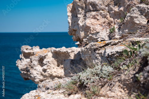 Beautiful white rocks on the background of the sea. Summer coastline landscape. Travel and holidays in the south.