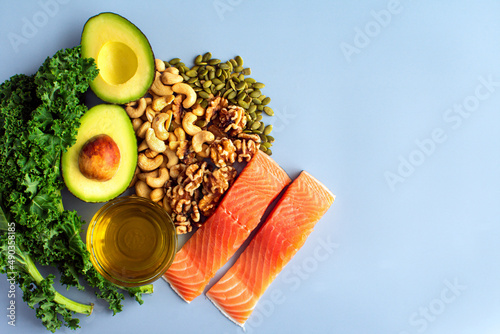 Overhead View of Fresh Omega-3 Rich Foods: A variety of healthy foods like fish, nuts, seeds, fruit, vegetables, and oil rich in omega-3 nutrients photo