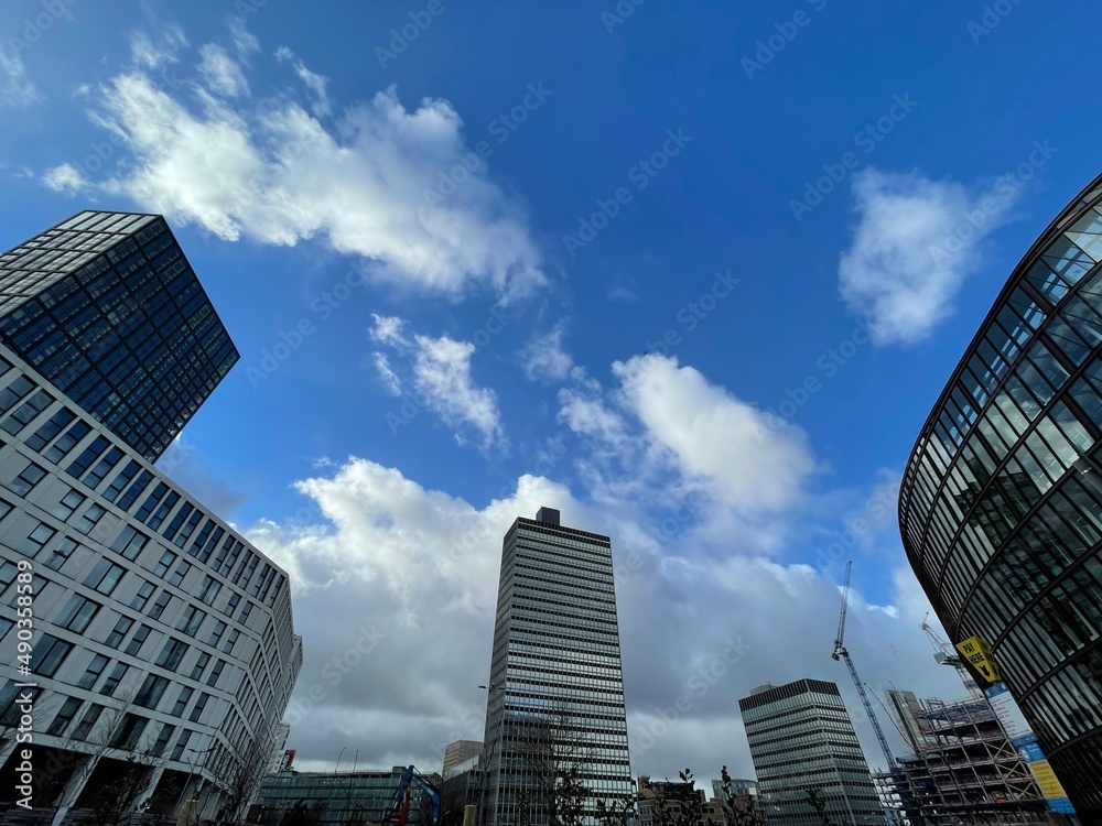 Looking up at modern buildings with incredible architectural details. Taken in Manchester England. Looking up at modern buildings with incredible architectural details. Taken in Manchester England.