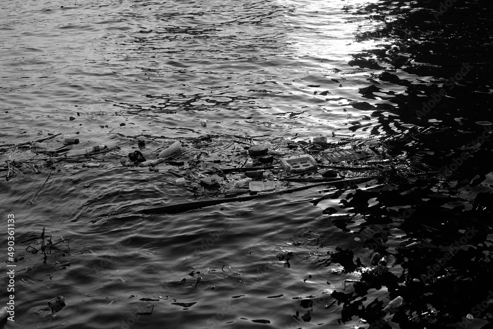water with garbage black and white river sea