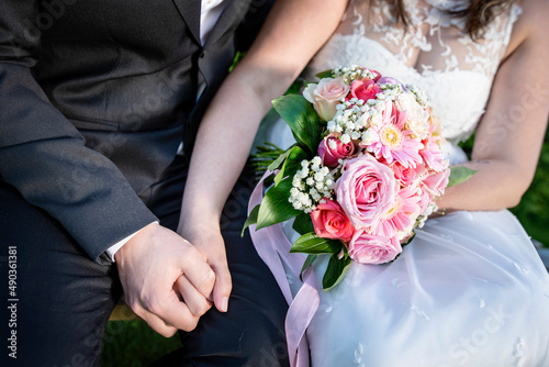 Wedding couple holding hands