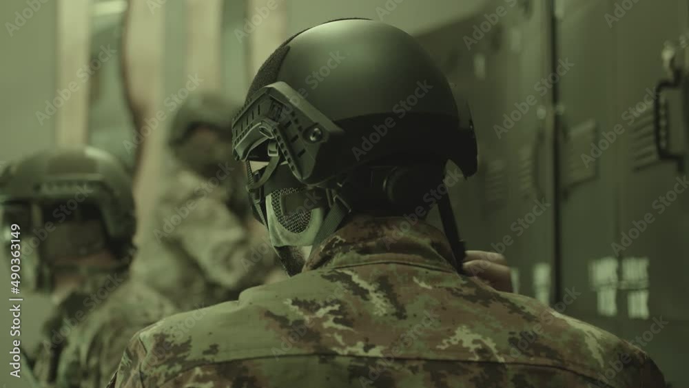 Group of Soldiers or Special Forces preparing for a fight in a military