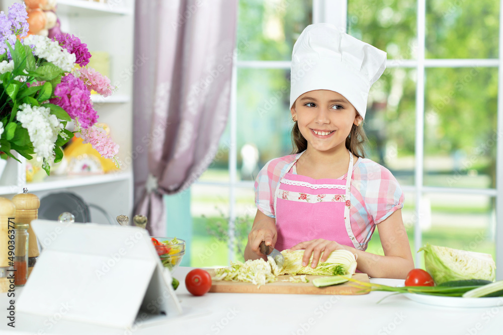 Portrait of cute little girl preparing fresh salad Portrait of cute little girl preparing fresh salad