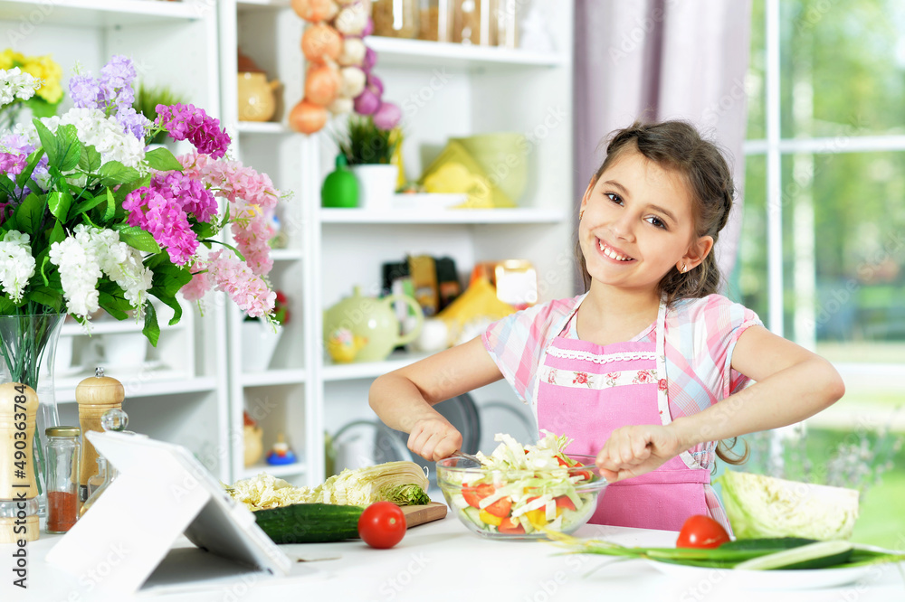 Portrait of cute little girl preparing fresh salad Portrait of cute little girl preparing fresh salad