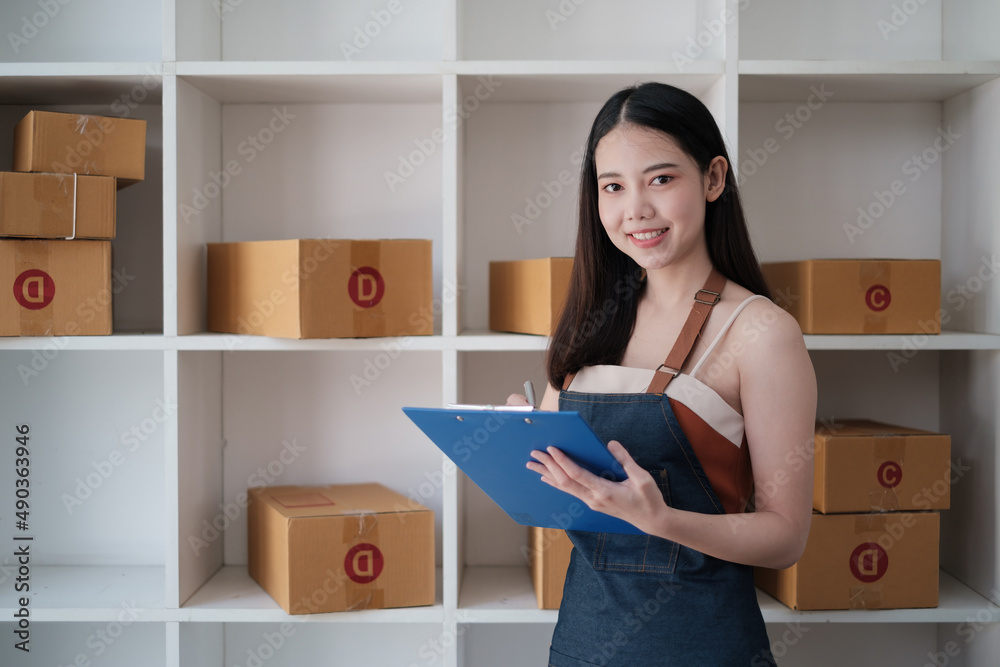 Asian small business owner working at home office. Business retail market and online sell marketing delivery, SME e-commerce concept. Asian small business owner working at home office. Business retail market and online sell marketing delivery, SME e-commerce concept.