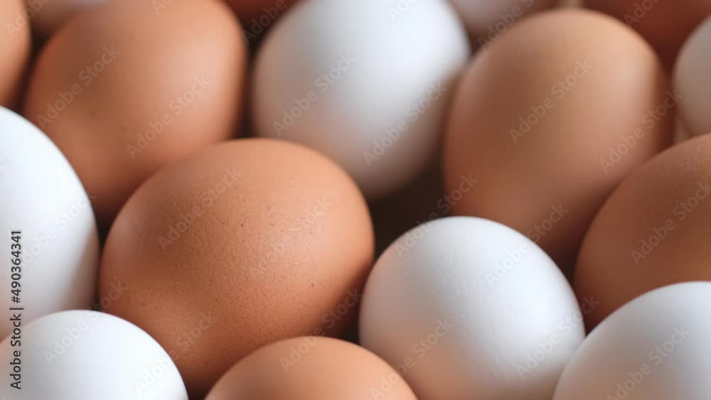 Chicken egg, rotation shot, Chicken fresh raw eggs.Healthy fresh food ingredients for breakfast. Animal products. Grocery. Chicken farm fresh eggs Chicken egg, rotation shot, Chicken fresh raw eggs.Healthy fresh food ingredients for breakfast. Animal products. Grocery. Chicken farm fresh eggs