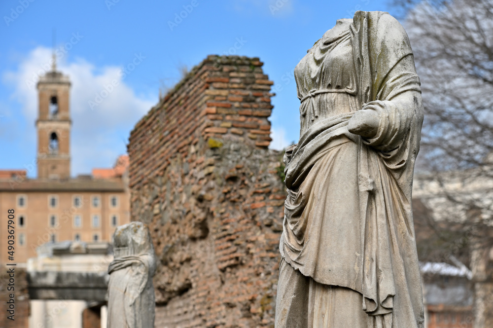 Sculptures at ruins of the ancient roman forum in Rome, Italy