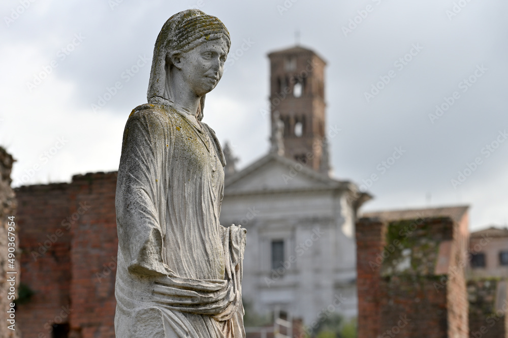 Sculpture at ruins of the ancient roman forum in Rome, Italy