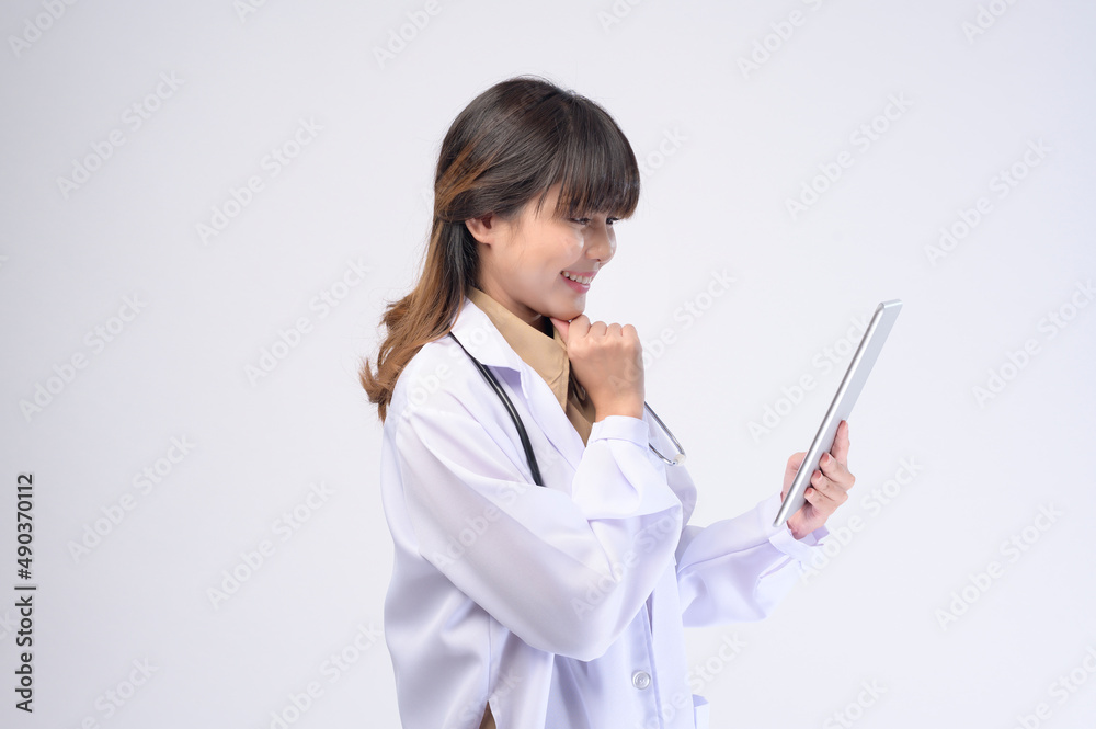 Young female doctor with stethoscope over white background Young female doctor with stethoscope over white background