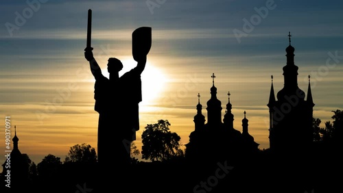 Mother Motherland statue devoted the Great Patriotic War in Kiev, Ukraine Capital Skyline, Time Lapse at Sunset photo