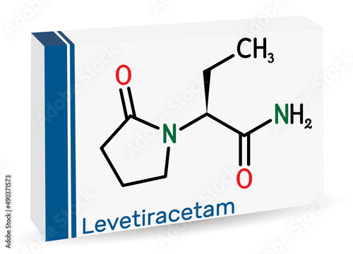 Levetiracetam molecule. It is pyrrolidine, anticonvulsant medication used to treat epilepsy. Skeletal chemical formula. Paper packaging for drugs photo